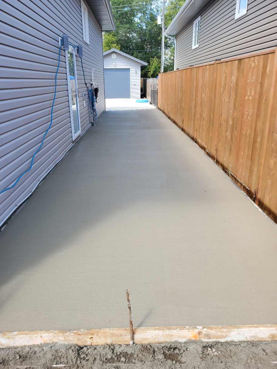 Broom-finished concrete driveway installation